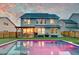 Inviting backyard with a pool, patio, and well-maintained lawn perfect for outdoor entertaining and relaxation at 158 Garden Lily Ln, Summerville, SC 29485