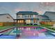 Stunning backyard featuring a swimming pool, covered patio and green space at 158 Garden Lily Ln, Summerville, SC 29485