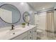 A modern bathroom with double sinks, stylish fixtures, a large mirror, and a shower-tub combo at 158 Garden Lily Ln, Summerville, SC 29485