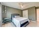 Neutral bedroom with light hardwood floors, a hanging plant, and decorative light at 158 Garden Lily Ln, Summerville, SC 29485