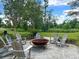 Relax in a community firepit area with comfortable chairs and scenic surroundings at 158 Garden Lily Ln, Summerville, SC 29485