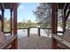 Scenic lake view from the property's wooden dock, with trees reflected in the water at 158 Garden Lily Ln, Summerville, SC 29485