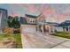 Charming two-story home boasts a well-manicured lawn and a spacious two-car garage at 158 Garden Lily Ln, Summerville, SC 29485