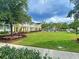 Enjoy the outdoors in the community's green space, surrounded by colorful homes at 158 Garden Lily Ln, Summerville, SC 29485