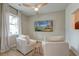 Bright living room features a ceiling fan and comfortable seating at 158 Garden Lily Ln, Summerville, SC 29485