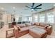 Open-concept living room features a comfortable sectional sofa and lots of natural light at 158 Garden Lily Ln, Summerville, SC 29485