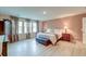 Spacious main bedroom with large windows, hardwood floors, and elegant furnishings at 158 Garden Lily Ln, Summerville, SC 29485