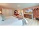 A beautifully decorated main bedroom features a white quilted bedspread and warm vintage furnishings at 158 Garden Lily Ln, Summerville, SC 29485