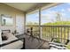 Relaxing balcony with outdoor furniture and a view of the trees and sky at 1597 Cambridge Lakes Dr # 303E, Mount Pleasant, SC 29464