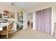 Well-lit office space with built-in shelving and potential storage area at 1597 Cambridge Lakes Dr # 303E, Mount Pleasant, SC 29464
