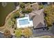 Aerial view of a community pool with chairs and manicured landscaping at 1597 Cambridge Lakes Dr # 303E, Mount Pleasant, SC 29464