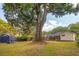 Large backyard featuring a home with an inviting wooden deck and a storage shed for tools and equipment at 1756 Mchenry Ave, Charleston, SC 29412