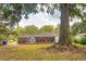 Expansive backyard with a charming brick home and a spacious wooden deck perfect for outdoor living at 1756 Mchenry Ave, Charleston, SC 29412