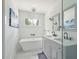Elegant bathroom with a soaking tub, double vanity, and modern fixtures at 1756 Mchenry Ave, Charleston, SC 29412