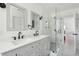 Bright bathroom featuring double sinks, and frameless glass shower at 1756 Mchenry Ave, Charleston, SC 29412