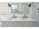 Bright bathroom featuring double sinks with modern fixtures at 1756 Mchenry Ave, Charleston, SC 29412