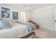 Bright bedroom with a ceiling fan, upholstered chair and view into ensuite bathroom at 1756 Mchenry Ave, Charleston, SC 29412