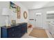 Stylish entryway featuring a decorative dresser, modern artwork, and a welcoming rug at 1756 Mchenry Ave, Charleston, SC 29412