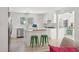 Charming kitchen with white cabinets, island with seating, and stainless steel appliances at 1756 Mchenry Ave, Charleston, SC 29412