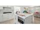 Modern kitchen with a center island, stainless steel appliances, and white cabinets at 1756 Mchenry Ave, Charleston, SC 29412
