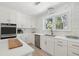 Spacious kitchen with white cabinets, stainless steel appliances, and hardwood floors at 1756 Mchenry Ave, Charleston, SC 29412