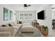 Inviting living room featuring a large sectional sofa, TV, and natural light at 1756 Mchenry Ave, Charleston, SC 29412