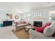Bright living room with a cozy fireplace, comfortable sofas, and stylish decor at 1756 Mchenry Ave, Charleston, SC 29412