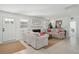 Cozy living room with neutral sofas, a decorative fireplace, and bright natural light at 1756 Mchenry Ave, Charleston, SC 29412