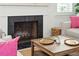 Inviting living room with a cozy fireplace and stylish furnishings at 1756 Mchenry Ave, Charleston, SC 29412