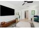 Open-concept living room with a TV, sectional sofa, and connected dining area at 1756 Mchenry Ave, Charleston, SC 29412