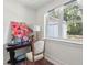 Bright office space with a view to the outside, an antique desk, and a floral painting at 1756 Mchenry Ave, Charleston, SC 29412
