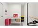 Bright office features a white desk, closet and cheerful artwork at 1756 Mchenry Ave, Charleston, SC 29412