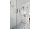 Modern tiled shower with glass door and built-in shelving niches at 1756 Mchenry Ave, Charleston, SC 29412