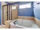 Beautiful bathroom features a modern tub with bronze fixtures and a glass-enclosed shower at 1909 Royal Empress Ct, Charleston, SC 29414