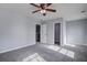 Comfortable bedroom featuring neutral walls, soft carpet, and doorways to bathroom and closet at 1909 Royal Empress Ct, Charleston, SC 29414