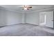 Bedroom with neutral paint and carpet and a ceiling fan, with an open doorway at 1909 Royal Empress Ct, Charleston, SC 29414