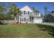 Charming two-story home featuring a manicured lawn, two car garage, and beautiful landscaping at 1909 Royal Empress Ct, Charleston, SC 29414
