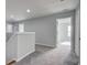 Upstairs hallway featuring neutral colored walls and carpets, and natural light at 1909 Royal Empress Ct, Charleston, SC 29414