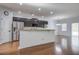 Modern kitchen with stainless steel appliances, dark cabinets, and an open layout at 1909 Royal Empress Ct, Charleston, SC 29414
