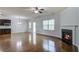 Living area featuring a fireplace, hardwood floors, and an open layout at 1909 Royal Empress Ct, Charleston, SC 29414
