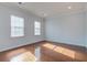 Sun-drenched room featuring gleaming hardwood floors, recessed lighting, and white trim at 1909 Royal Empress Ct, Charleston, SC 29414