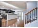 Open-concept living space featuring hardwood floors, stainless appliances, and lots of natural light at 1909 Royal Empress Ct, Charleston, SC 29414