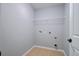 Unfinished laundry room featuring tile floor, utility connections, and access door at 1909 Royal Empress Ct, Charleston, SC 29414