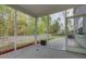 View of a screened-in porch featuring a concrete floor, brick border and an open view to the backyard at 1909 Royal Empress Ct, Charleston, SC 29414