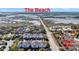 Expansive aerial view of real estate near the beach, gas station, and grocery store, with marsh views at 1984 Folly Rd # A306, Charleston, SC 29412