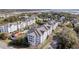 An overhead shot of condos, featuring balconies, a pool, and a glimpse of the waterfront nearby at 1984 Folly Rd # A306, Charleston, SC 29412