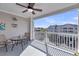 A comfortable outdoor balcony with seating and a view of the surrounding complex at 1984 Folly Rd # A306, Charleston, SC 29412