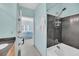 Modern bathroom features a tiled shower/tub combination and views of the bedroom at 1984 Folly Rd # A306, Charleston, SC 29412