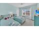 Bright bedroom with two twin beds and a view of the neighborhood for comfortable living at 1984 Folly Rd # A306, Charleston, SC 29412