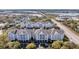 Exterior view of condominiums with balconies, showing the architectural details and surrounding landscaping at 1984 Folly Rd # A306, Charleston, SC 29412